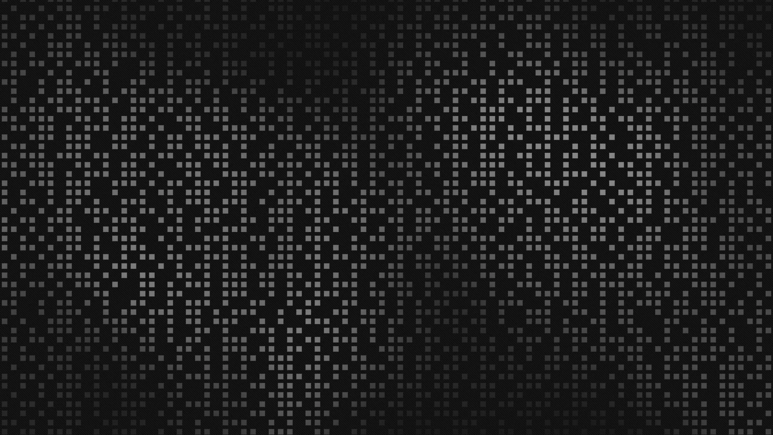 Abstract dark background of small grey and white pixel squares scattered in a halftone-style dot pattern