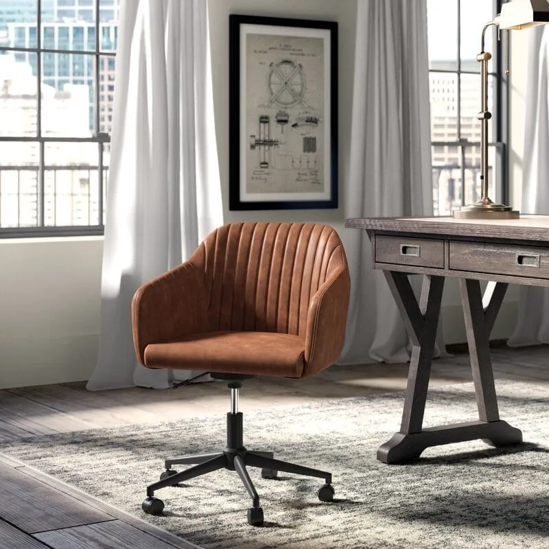 Interior inspiration — tan leather channel-tufted office chair on casters beside a dark wood desk