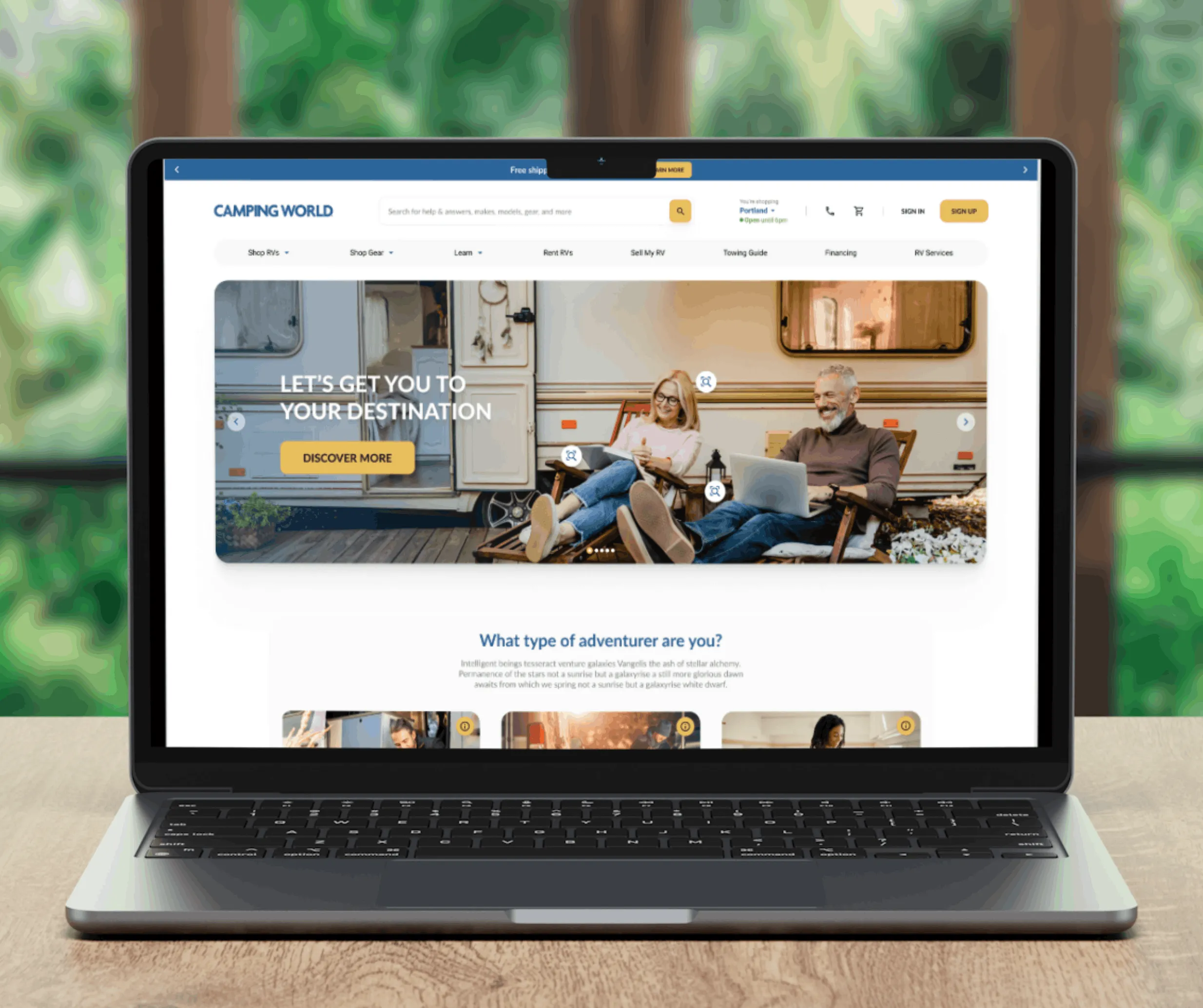 Laptop mockup of the redesigned Camping World homepage with a couple relaxing by an RV and a 'What type of adventurer are you' section