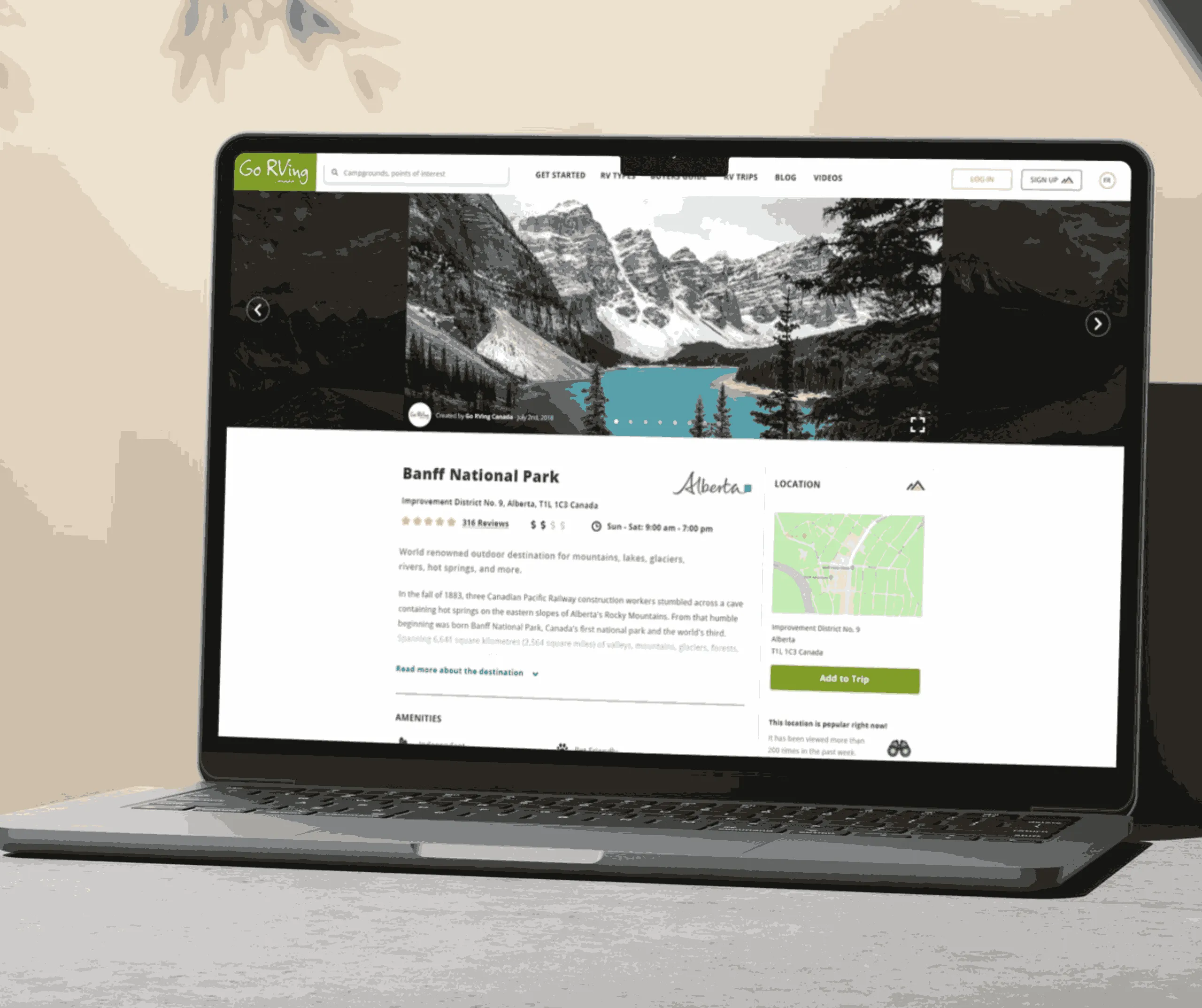 Banff National Park destination screen with scenic mountain-lake photos, reviews, description and a location map