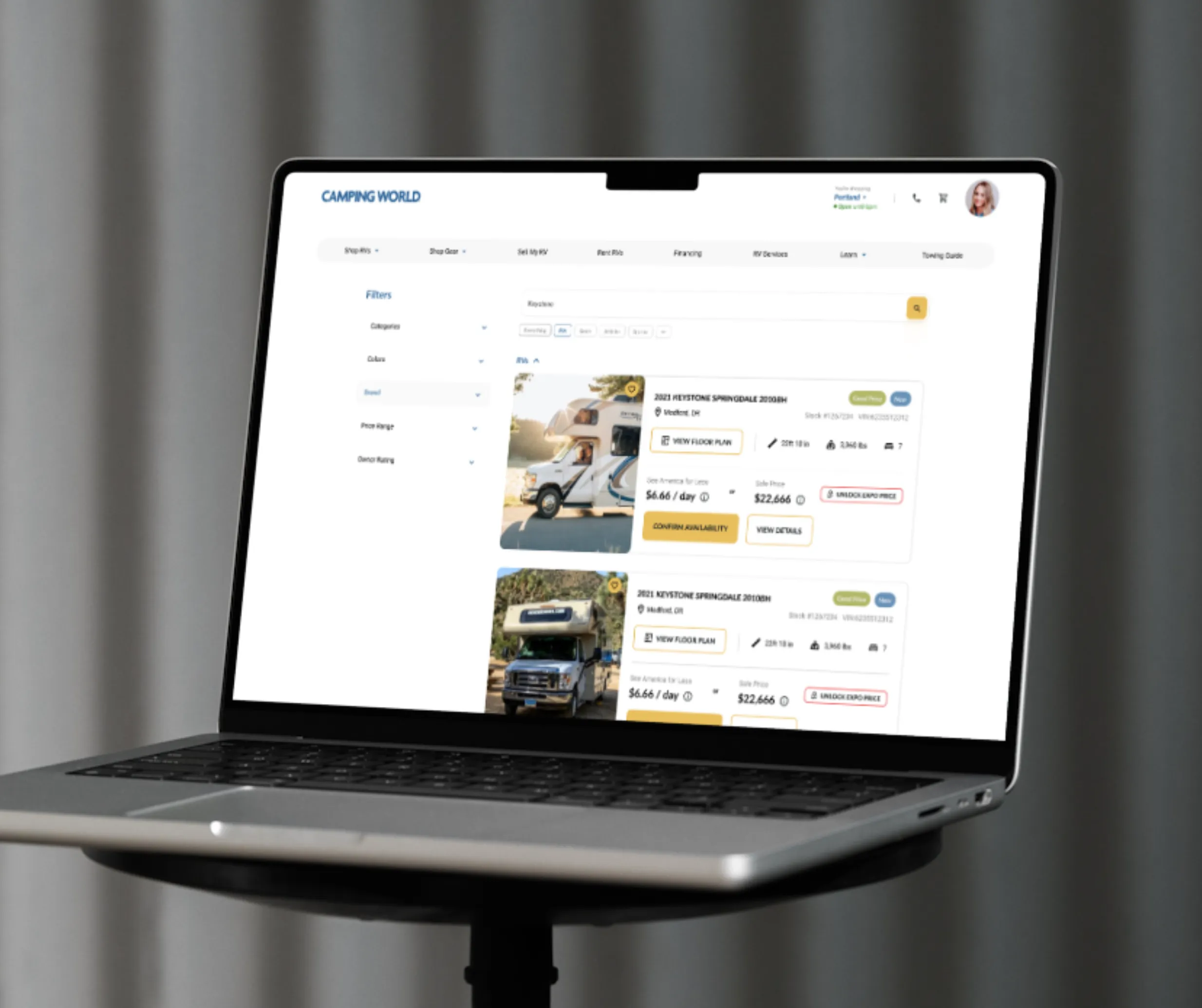 Laptop mockup of Camping World RV listings search page with filters and Keystone Springdale travel trailer results